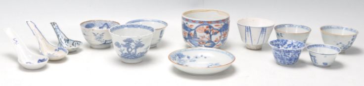 A collection of 19th Century Chinese blue and white tea bowls, each having hand painted blue and