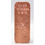 A copper bullion bar inscribed with " FINE COPPER .999 ONE KILO UK ".