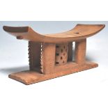 A carved African tribal Akan / Asante Ghanaian anthropomorphic stool having a rectangular curved