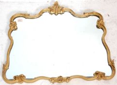 A Victorian 19th century Florentine wall mirror the central mirror glass in stunning rococo shaped