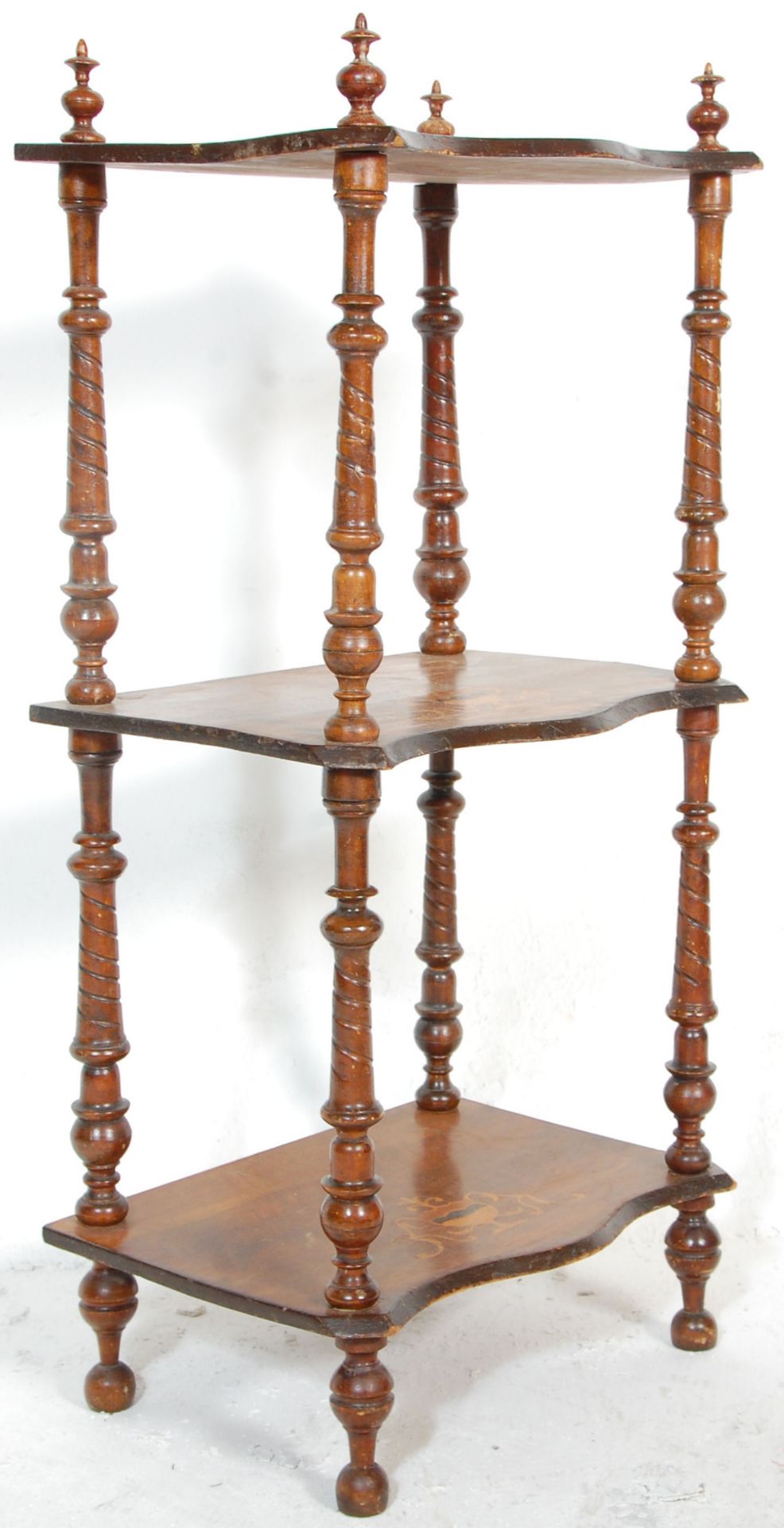 A 19th Century Victorian mahogany whatnot étagère shelving unit having three tiers of serpentine