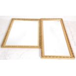 A large 20th century gilt framed rococo rectangular wall mirror with cushion type frame and of