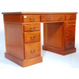 A 20th Century antique style twin pedestal desk having three drawers to the frieze with banks of