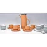 A vintage retro 20th Century Purbeck pottery coffee service consisting of four brown glazed coffee