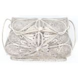 A good continental silver ladies purse having a decorative filigree body with hinged opening top.