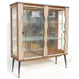 A retro mid 20th Century, circa 1950's formica china display cabinet vitrine. Raised on ebonised