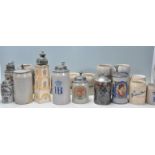A collection of German stoneware steins to include a selection of different ages including some