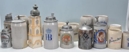 A collection of German stoneware steins to include a selection of different ages including some