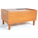 A vintage retro 20th Century teak wood coffee table of rectangular form having sliding lid opening