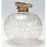 An antique early 20th Century art nouveau etched glass perfume bottle with a hallmarked sterling