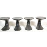 A set of four vintage retro stools Tulip style side tables of round form having black paintwork