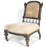 A Victorian 19th century Aesthetic movement nursing chair. Raised on turned, tapering legs with