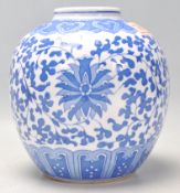 A 20th Century Chinese transfer printed blue and white ginger jar decorated in the scrolling lotus