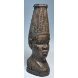 A 20th Century large African tribal well-carved hard-wood bust of a Nigerian woman with strong