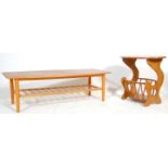 A retro 20th Century Danish inspired surfboard top teak coffee table raised on tapering legs with