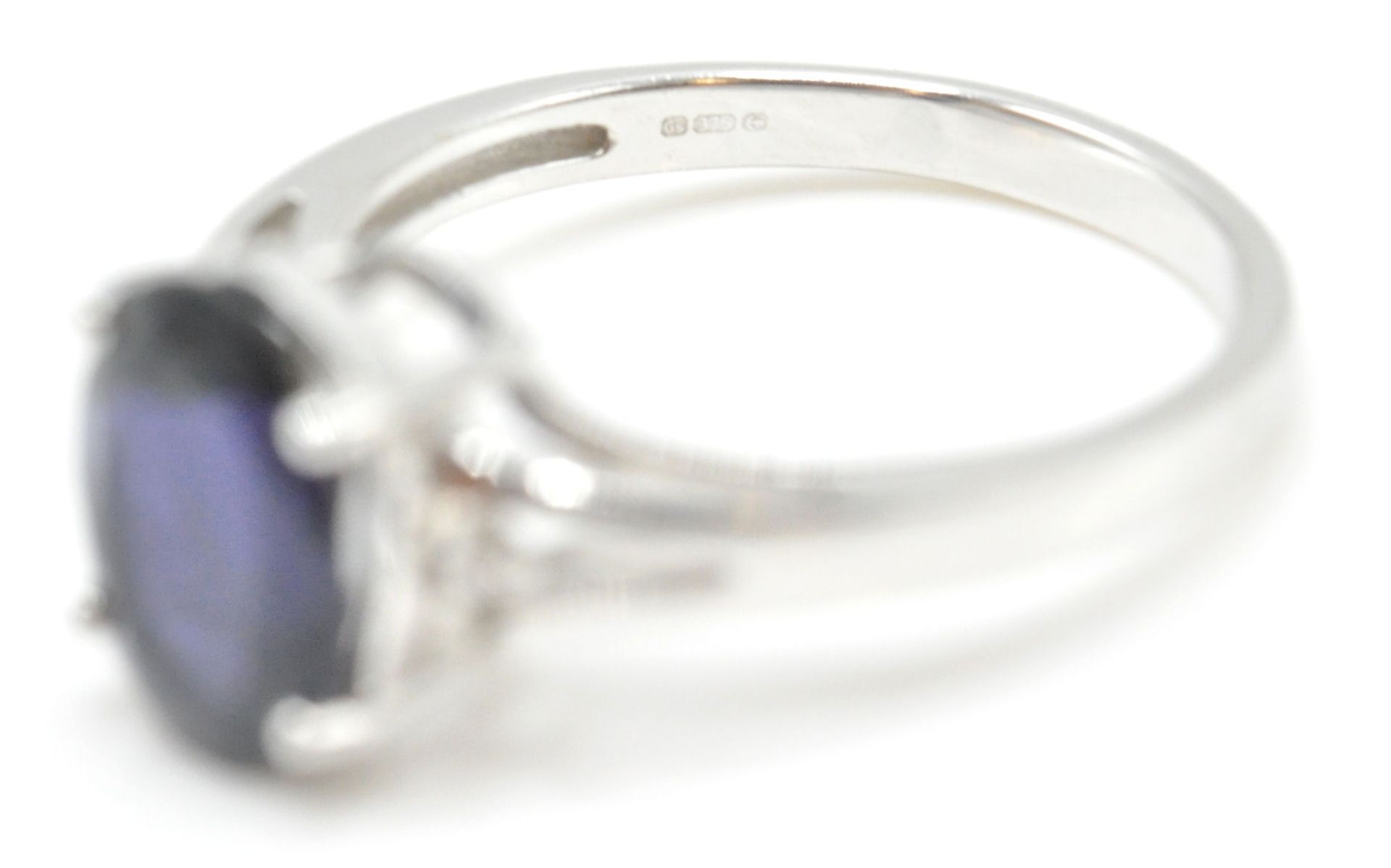 A 9ct white gold and blue oval cut single stone ring in prong setting being hallmarked for - Image 15 of 15