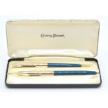 A boxed set of two Conway Stewart vintage writing pens to include one fountain ink pen and a
