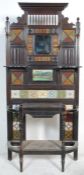 A 19th Century Victorian mahogany framed tiled hall stand with a carved pediment to the top, and a