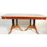 A large impressive extendable regency revival dining table consisting of a maple, satinwood, ebony &