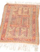 A good vintage 20th Century hand woven Persian / Islamic floor rug having a red central ground