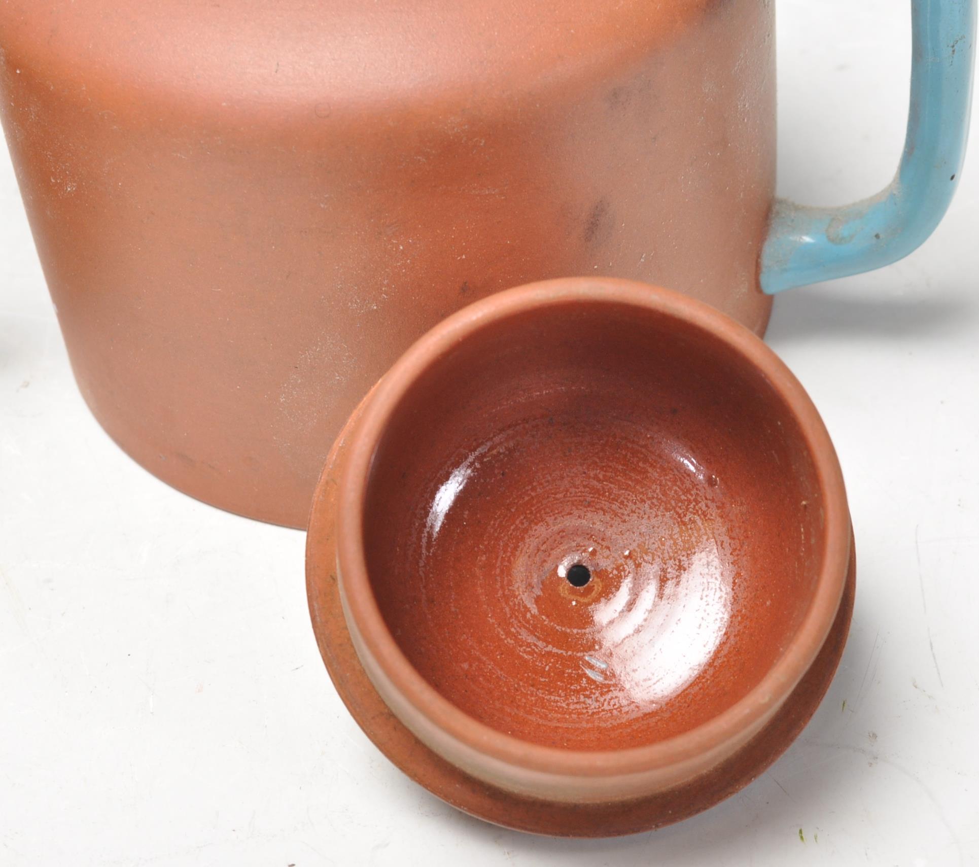 A collection of Chinese yixing teapots each of red clay terracotta form. To include a cylindrical - Image 8 of 12