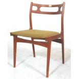 A stunning mid 20th Century retro teak framed dining chair raised on splayed tapering legs with a