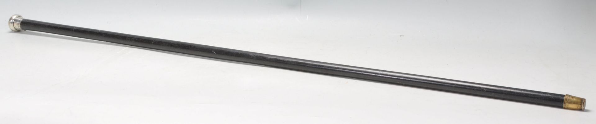 A 1929 Silver topped ebonised evening cane of tapering form. Measures 92cm
