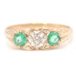 An impressive 9ct yellow gold emerald and diamond three stone ring. Weighs 3.1g Size 8.Q. .33