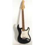 A Fender Stratocaster style Rockburn six string electric guitar having three control knobs with a