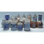 A collection of 20th Century German ceramic stein drinking glasses, many having raised blue and grey