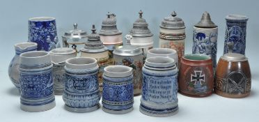 A collection of 20th Century German ceramic stein drinking glasses, many having raised blue and grey