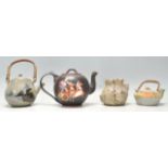 A collection of Chinese terracotta and pottery teapots to include celadon glazed teapot with