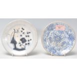 An 18th Century Japanese blue and white small plate having hand painted decoration of a perched bird
