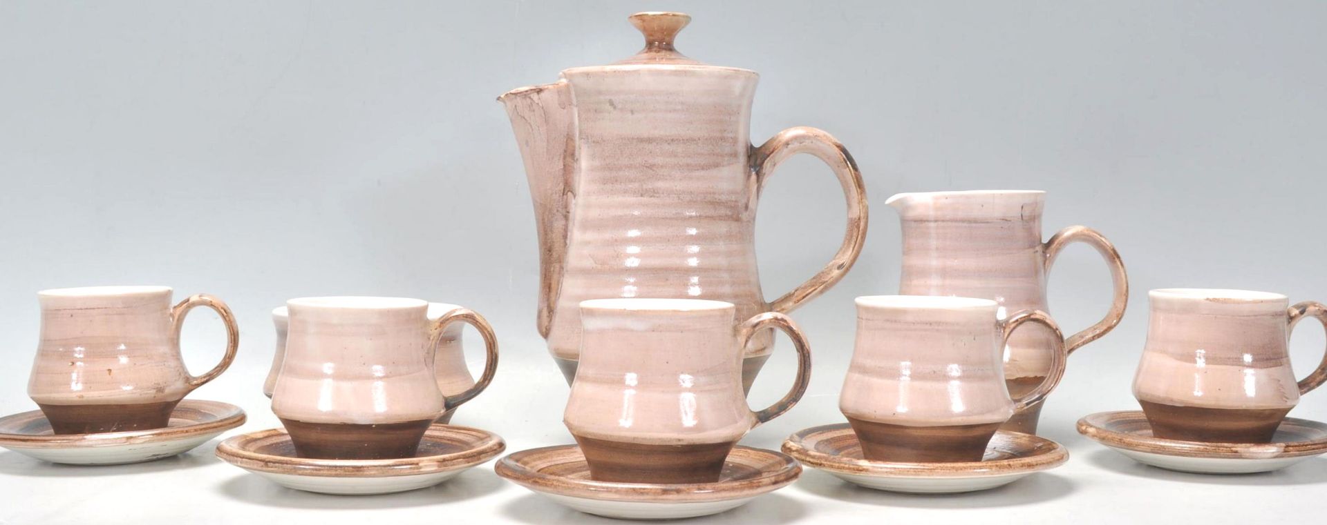 A vintage retro 20th Century Rye pottery coffee service consisting of coffee pot, six cups and