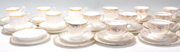 A mixed group of four A Fine Bone China English gilt part tea services. One set by Royal Stafford