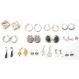 A large collection of silver earrings  and clips. To include creole hoop,  stone set with pierced