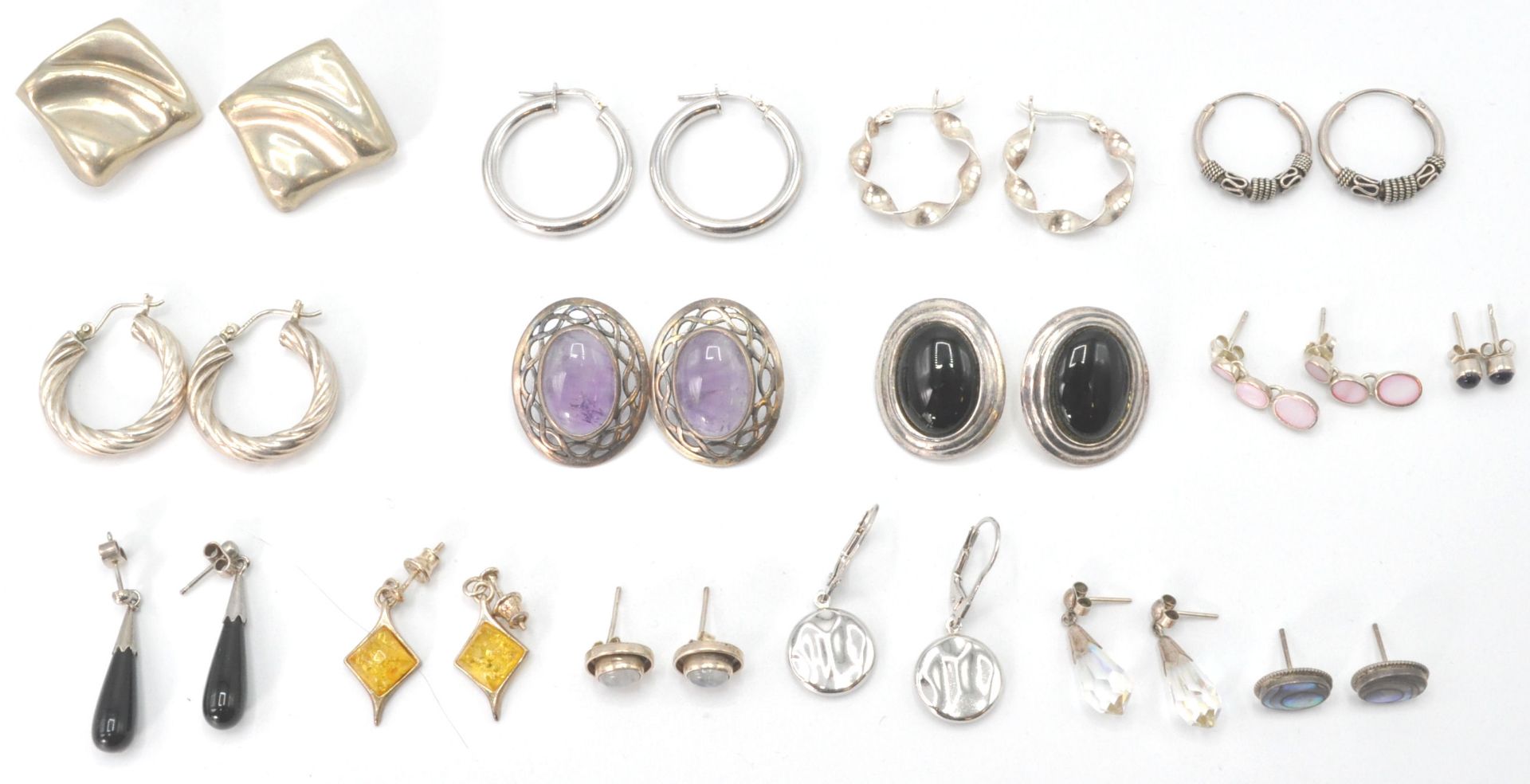 A large collection of silver earrings  and clips. To include creole hoop,  stone set with pierced