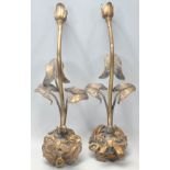 A pair of 20th century retro gilt metal wall lights of rococo form with bow ribbon and floral mounts