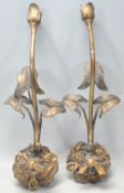 A pair of 20th century retro gilt metal wall lights of rococo form with bow ribbon and floral mounts