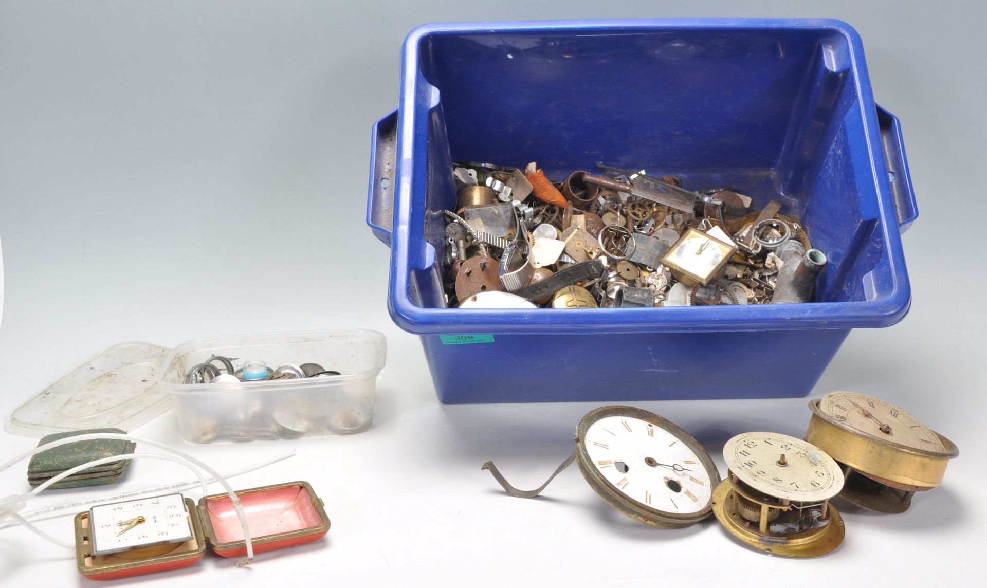 A collection of vintage spare watch and clock part