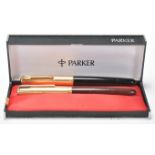 Two vintage Parker writing pens each having plastic cased bodies with rolled gold lids with arrow