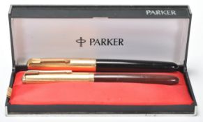 Two vintage Parker writing pens each having plastic cased bodies with rolled gold lids with arrow