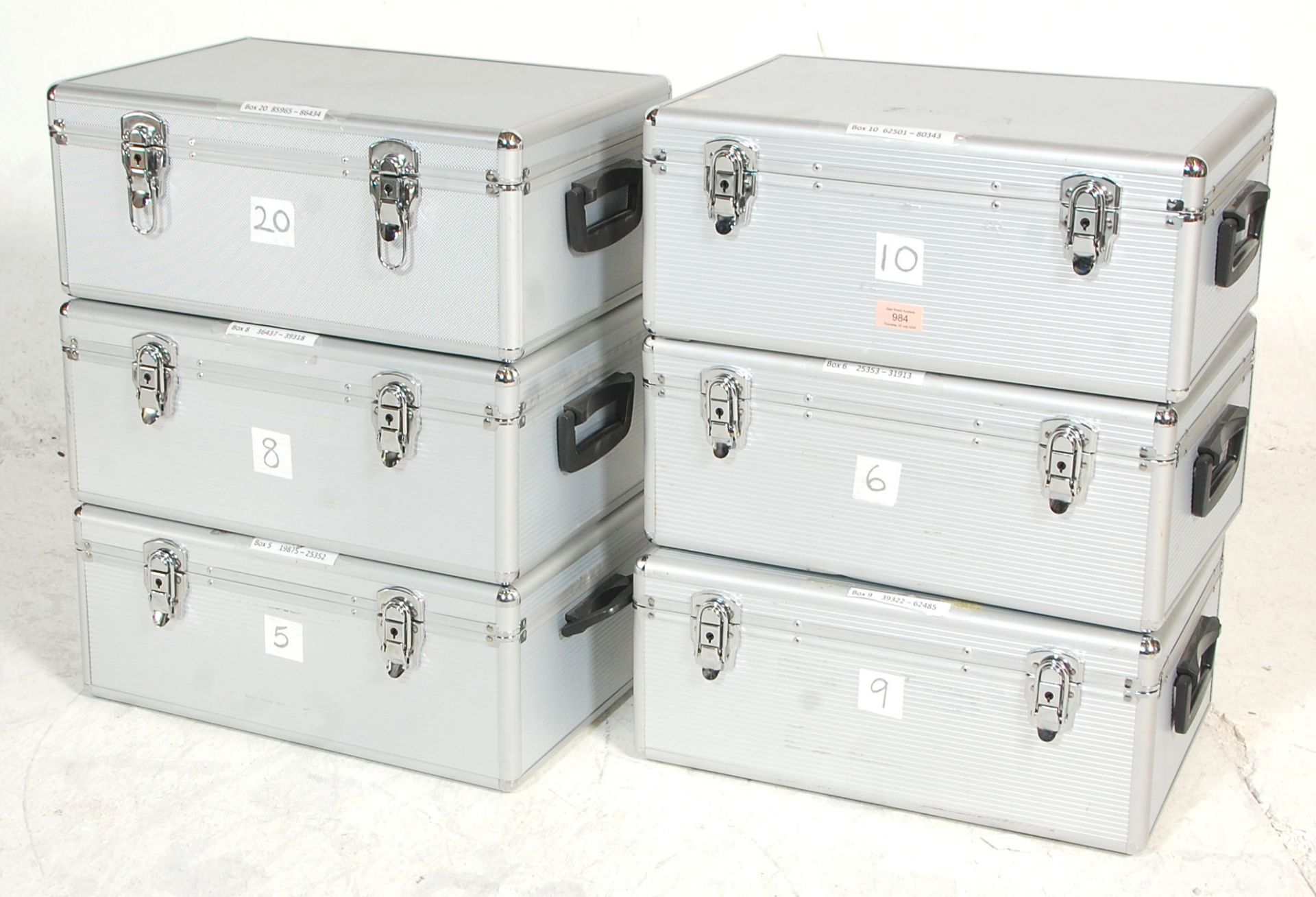 A set of six aluminium flight / travel cases each one having handles to either side and claps to the