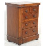 An 19th Century Victorian mahogany 2 over 3 apprentice piece chest raised on bun feet.