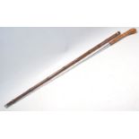 A vintage 20th Century bamboo sword stick / walking stick cane of slim form having a root knot