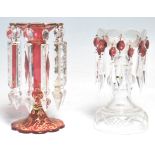 Two 19th Century Victorian glass lustres to include a cranberry glass example with a scalloped