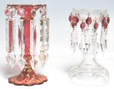 Two 19th Century Victorian glass lustres to include a cranberry glass example with a scalloped