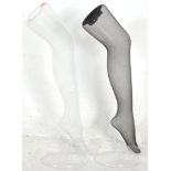 A pair of modern shop display / advertising plastic dummy legs for stockings / tights.  73cm high.