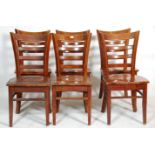 A matching set of seven cafe / pub rail back chairs having wide seat pads with bent wood