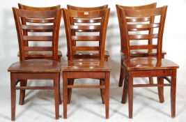 A matching set of seven cafe / pub rail back chairs having wide seat pads with bent wood
